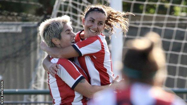 Maria Mendonca is hugged by a team-mate