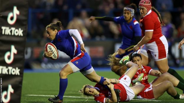Laure Sansus of France gets through to score a try