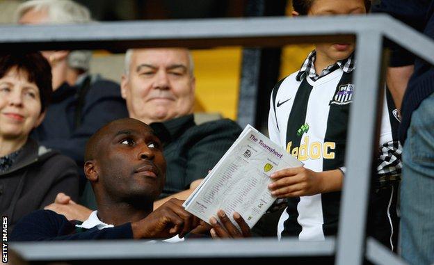Sol Campbell signs an autograph for a young Notts County fan in September 2009