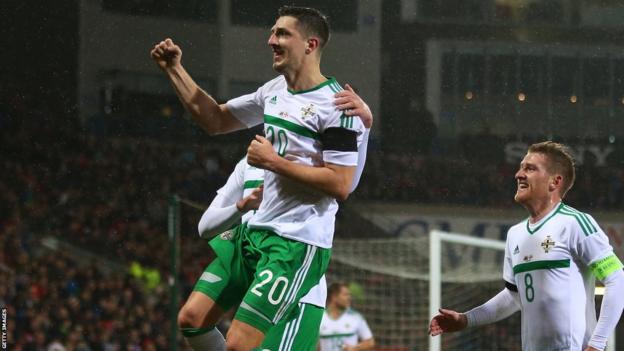 Craig Cathcart celebrates scoring for Northern Ireland against Wales in Cardiff in 2016