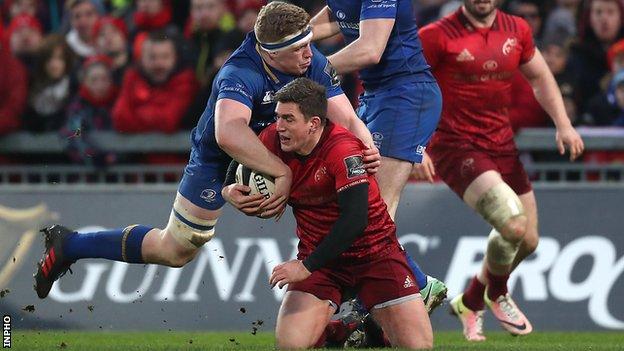 Leinster's Dan Leavy tackles Munster's Ian Keatley's at Thomond Park