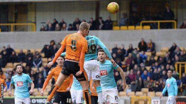 George Saville heads Wolves' winning goal - his second of the game - against Derby County