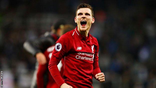 Liverpool left-back Andrew Robertson celebrates after victory over Newcastle