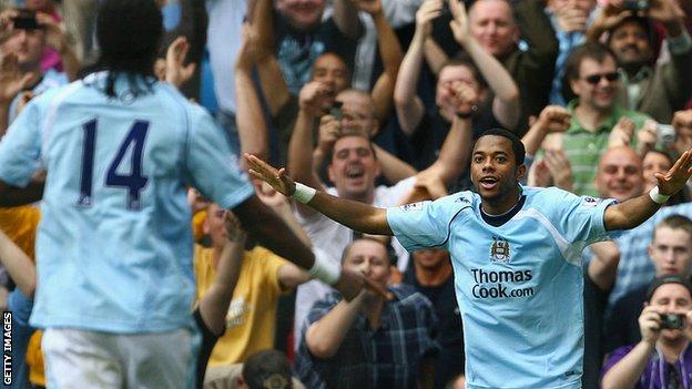 Robinho, right, celebrates a Manchester City goal