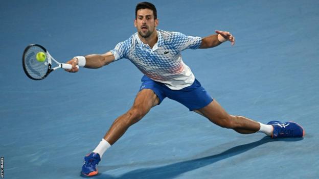 Novak Djokovic stretches the ball in the Australian Open final