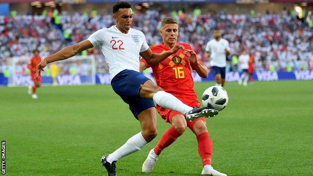 Trent Alexander-Arnold of England crosses the ball under pressure from Thorgan Hazard of Belgium during the 2018 World Cup