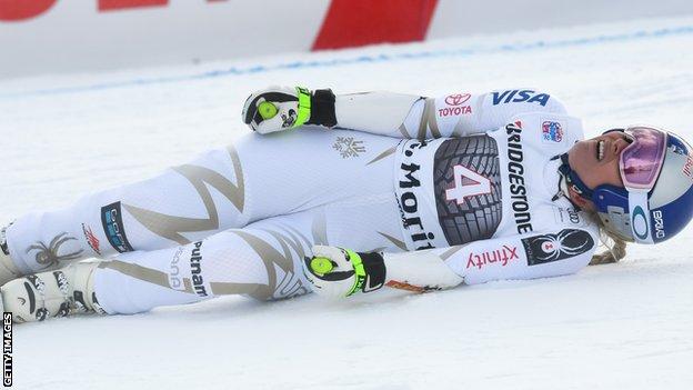 The USA's Lindsey Vonn lies hurt during the women's Super-G in St Moritz