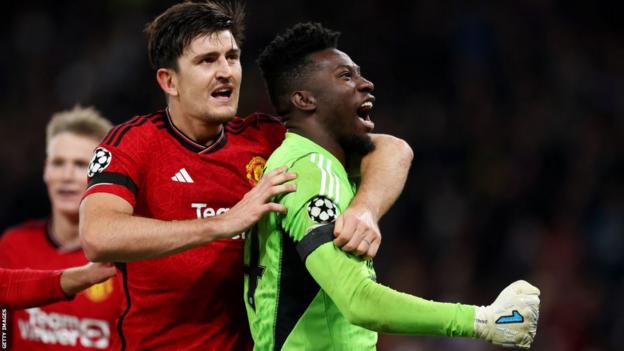 Andre Onana and Harry Maguire of Manchester United