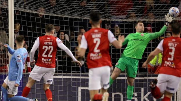 Larne keeper Rohan Ferguson produces a superb save to deny Sean Graham at Seaview