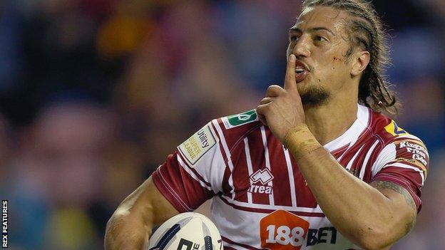 Anthony Gelling tries to silence St Helens fans as he runs in Wigan's second try