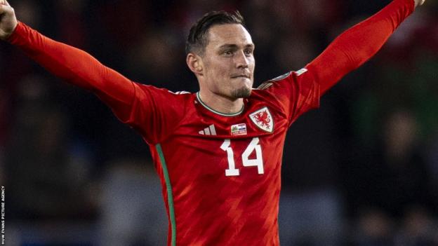 Connor Roberts celebrates Wales' win over Croatia