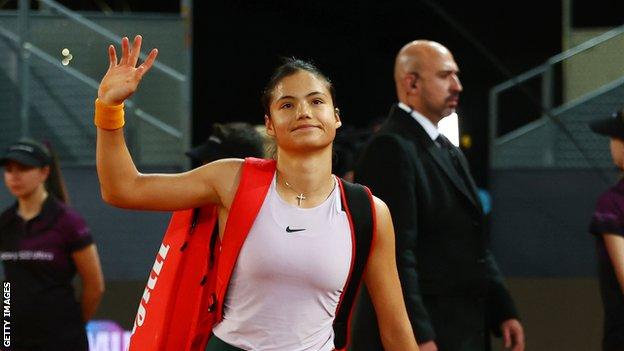 Emma Raducanu waves after losing to Anhelina Kalinina at the Madrid Open