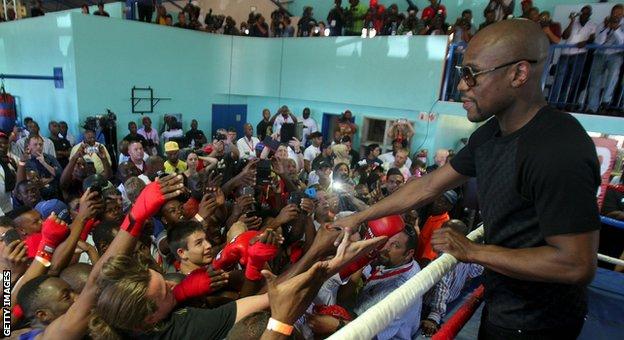 Floyd Mayweather Jnr visits the Dube Boxing Club in Soweto, South Africa, in January 2014