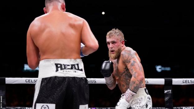 Nate Diaz and Jake Paul in the ring