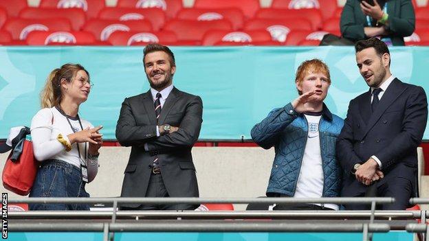 Cherry Seaborn, David Beckham and Ed Sheeran are seen in the stands at Wembley
