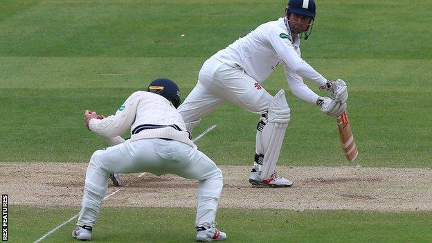 Alastair Cook is caught by Stevie Eskinazi at short leg