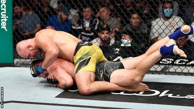 Glover Teixeira of Brazil works for a rear choke submission against Jan Blachowicz of Poland