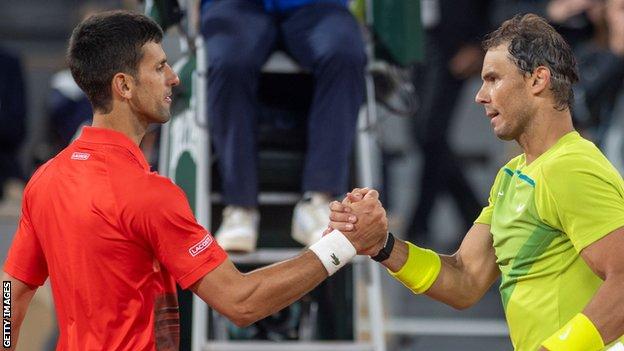 Novak Djokovic and Rafael Nadal shake hands after their quarterfinal match at the 2022 French Open