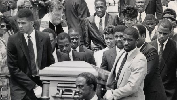 Len Bias' coffin is carried out of a memorial service at the University of Maryland