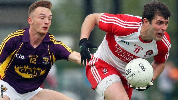Wexford's Kieran Butler attempts to catch Derry captain Mark Lynch