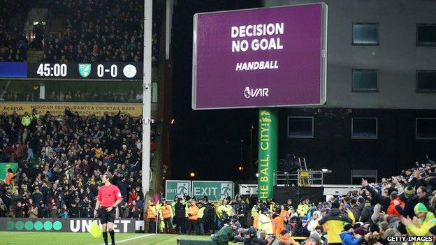 The big screen at Carrow Road displaying that a goal has been disallowed for handball following a VAR check