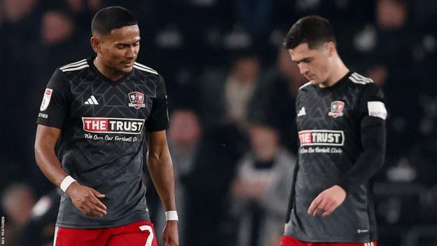 Exeter City's Demitri Mitchell and Jack Aitchison look dejected after defeat by Derby County