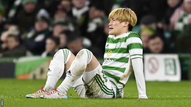 Celtic striker Kyogo Furuhashi sits after being injured against Real Betis