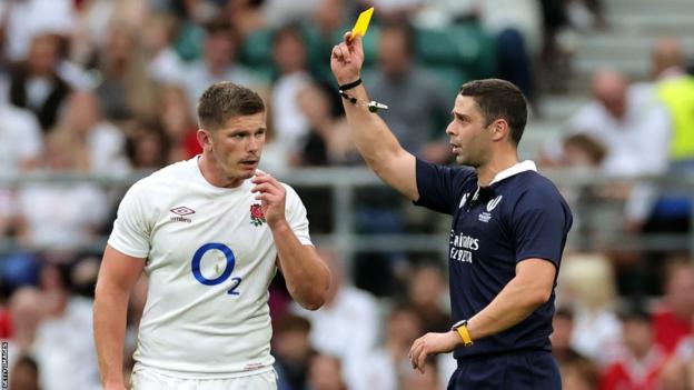 Nika Amashukeli, the referee, shows Owen Farrell, the England captain, a yellow card which was later upgraded to red