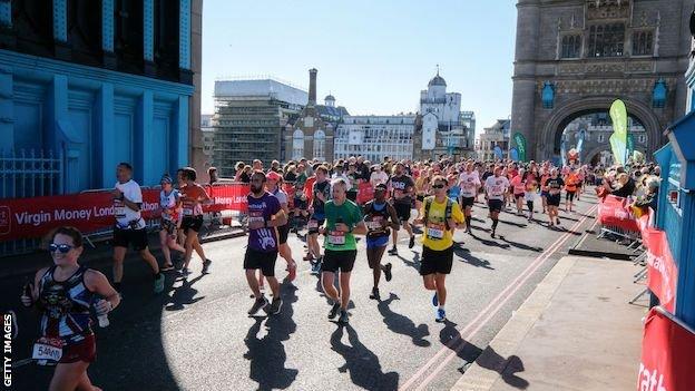 London Marathon runners cross Tower Bridge in 2021