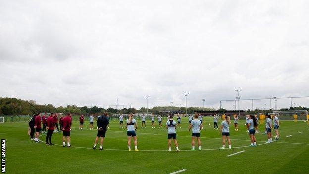 Aston Villa players and staff pay their respects to Her Majesty Queen Elizabeth II with a minute's silence