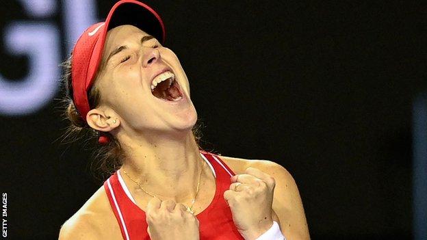 Belinda Bencic celebrates earning victory for Switzerland at the Billie Jean King Cup