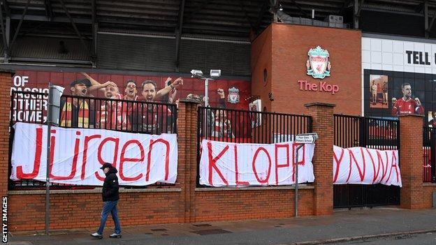 A sign showing support for Klopp has been put up outside Anfield