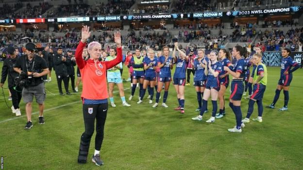 Megan Rapinoe waves farewell after her final game