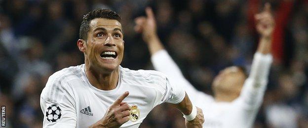 Real Madrid forward Cristiano Ronaldo celebrates scoring against Wolfsburg in the Champions League