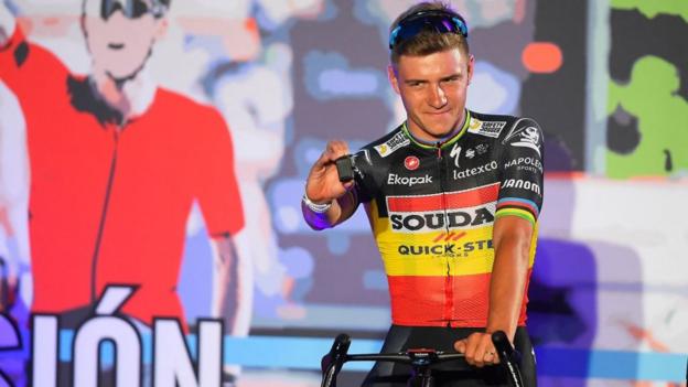 Remco Evenepoel poses as he sits on his bike