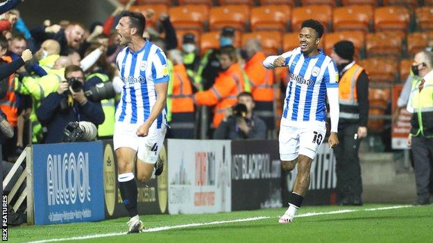 Matty Pearson (left) has scored three goals in the past five Championship matches for Huddersfield