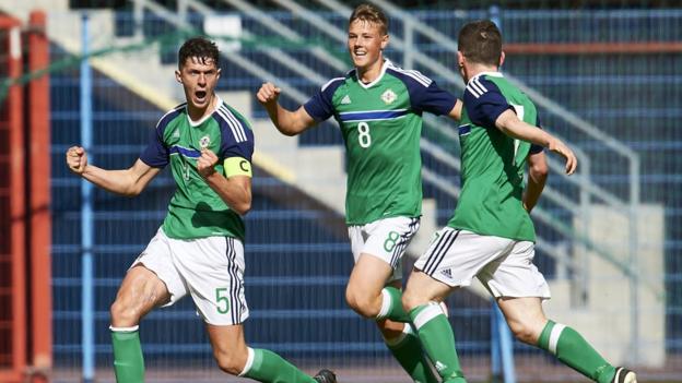 Eoin Toal (left) celebrates scoring for Northern Ireland Under-19s against Germany