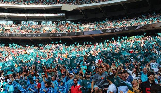 New Orleans Saints and Miami Dolphins fans prior to the NFL International  Series match at Wembley Stadium, London Stock Photo - Alamy