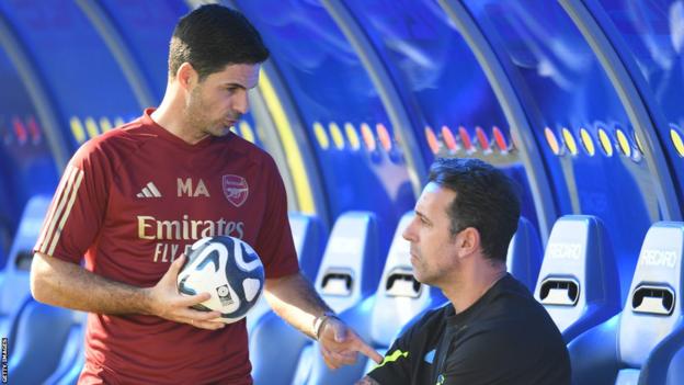 Arsenal manager Mikel Arteta (left) chatting to the club's sporting director Edu