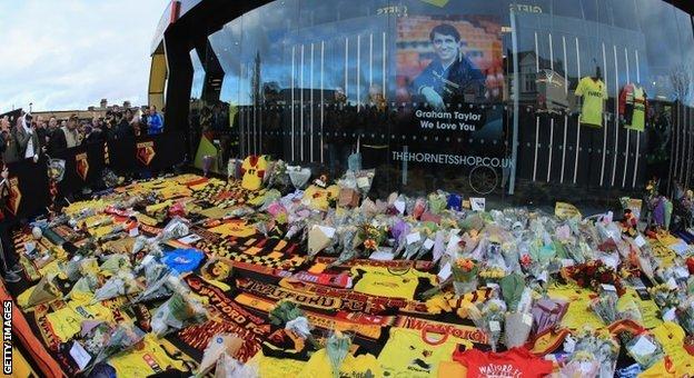Fans laid flowers, scarves and club shirts outside the stadium