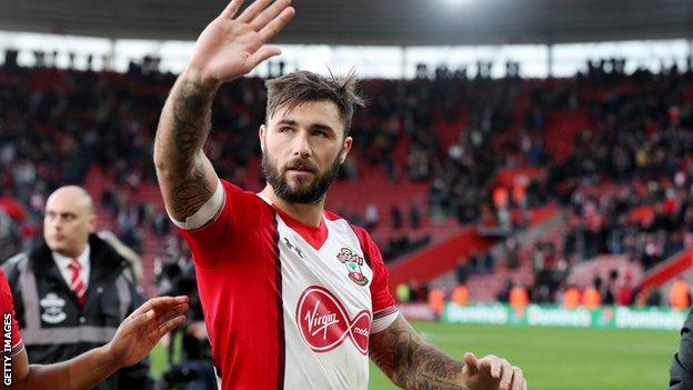 Charlie Austin waves to fans at the final whistle