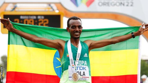 Tamirat Tola celebrates his men's marathon win at the World Athletics Championships in Eugene
