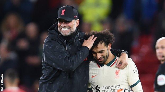 Liverpool boss Jurgen Klopp celebrates this side's win against Manchester United at Old Trafford with Mohamed Salah