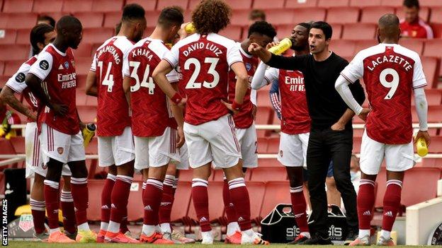 Arsenal having a drinks break