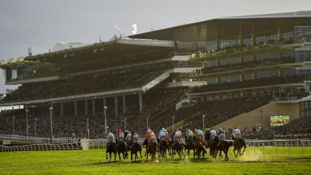 A general view of horses racing at the Cheltenham Festival in 2022