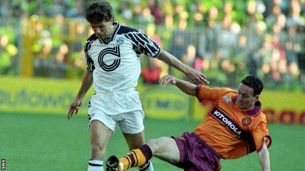 Paul Lambert tackles Andreas Moller in a Uefa Cup tie