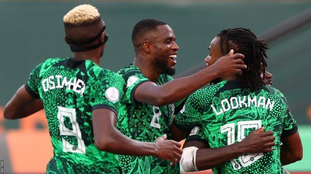 Nigeria celebrate a goal against Angola