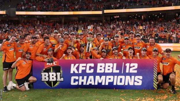 Perth Scorchers celebrating with the Big Bash trophy