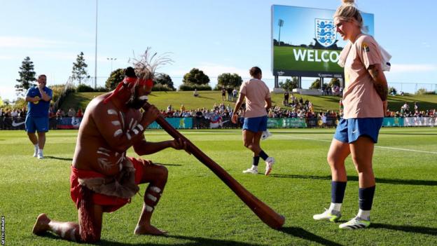 England's Millie Bright looks connected  arsenic  a smoking ceremonial  is conducted by the Gubbi Gubbi People pursuing  a grooming  league   astatine  the Sunshine Coast Stadium