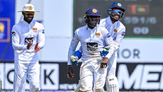 Sri Lanka wicketkeeper Sadeera Samarawickrama (right) and team-mate Nishan Madushka (centre) celebrate after taking the wicket of Ireland's Curtis Campher